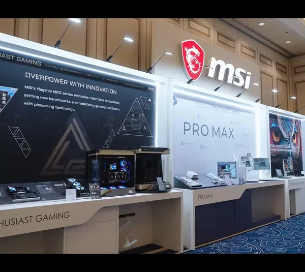 MSI product display showcases gaming hardware and "PRO MAX" series with illuminated signage and sleek, modern counter setups in a spacious room.