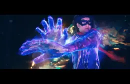 Kamala Khan as Ms. Marvel, with a flowing red cape harnessing energy, projecting large, glowing blue hands. The scene is dynamic and vibrant, exuding power.