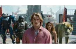 "Masters of the Universe" (2026) casts a group of diverse heroes, including a man in a pink shirt, a woman, a tiger, and armored figures, who stand determined in an ancient, mythic setting.