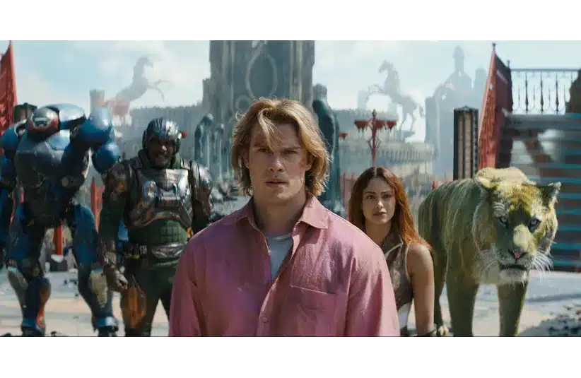 Masters of the Universe (2026) casts a group of diverse heroes, including a man in a pink shirt, a woman, a tiger, and armored figures, who stand determined in an ancient, mythic setting.