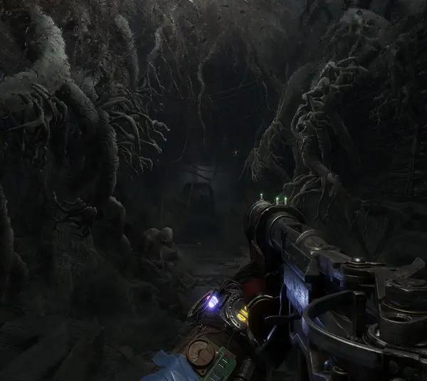 A first-person view in a dark, eerie tunnel filled with twisted roots in Metro Exodus. The scene is tense, with a gun aiming forward, illuminated by dim light. Metro 4