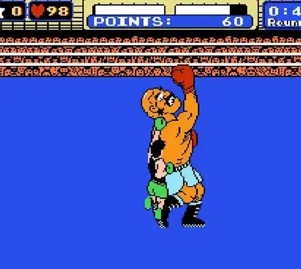 Retro video game scene, Punch-Out, showing two boxers in a ring, one delivering an uppercut. A points counter displays 60, with 40 seconds in round 1 remaining.