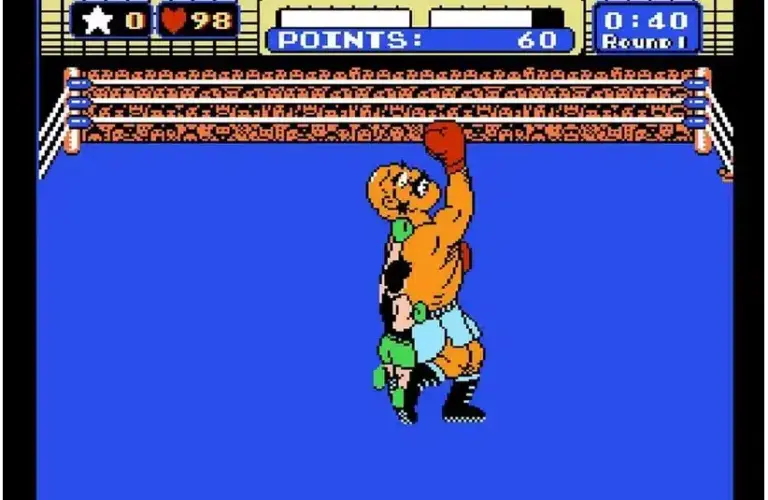 Retro video game scene, Punch-Out, showing two boxers in a ring, one delivering an uppercut. A points counter displays 60, with 40 seconds in round 1 remaining.