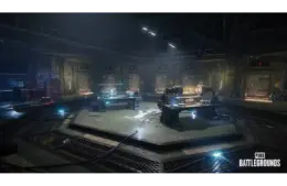 Dimly lit futuristic lab in PUBG: Battlegrounds Xeno Point, with circular layout, machinery, and glowing control panels. A mysterious, high-tech atmosphere prevails. PUBG Battlegrounds logo in the corner.