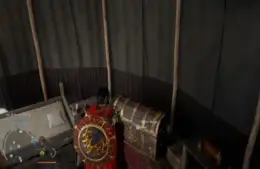Cliff looking at his personal storage chest among other miscellaneous things inside an open tent