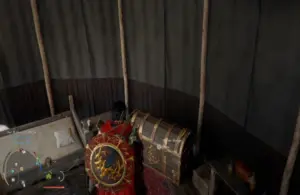 Cliff looking at his personal storage chest among other miscellaneous things inside an open tent