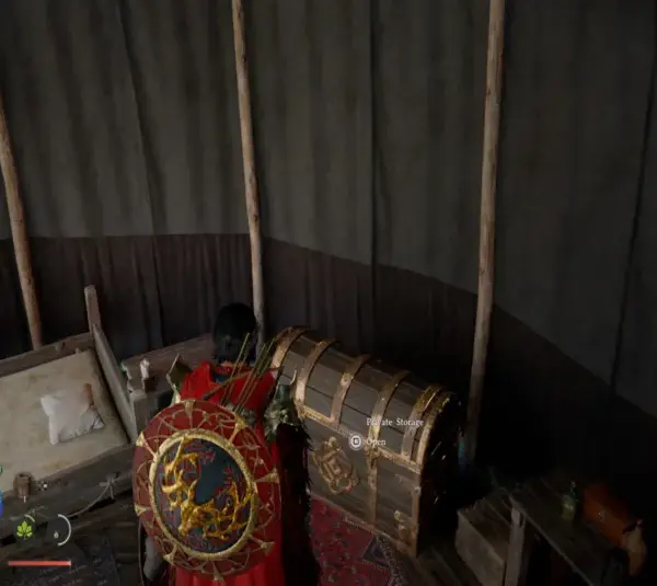 Cliff looking at his personal storage chest among other miscellaneous things inside an open tent