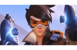 Tracer a character from Overwatch with short spiky hair, wearing goggles, holds high-tech pistols emitting blue light, conveying determination and readiness for action.