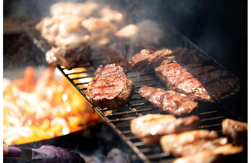 Steak sizzling on a grill