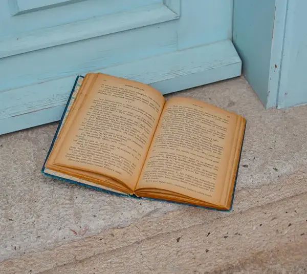 In daily devotional, an open Bible sits by a door.