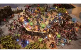 A vibrant battle scene from Stormgate shows futuristic soldiers in blue clashing with alien creatures in red. Set in a lush, tropical beach with vivid energy blasts.