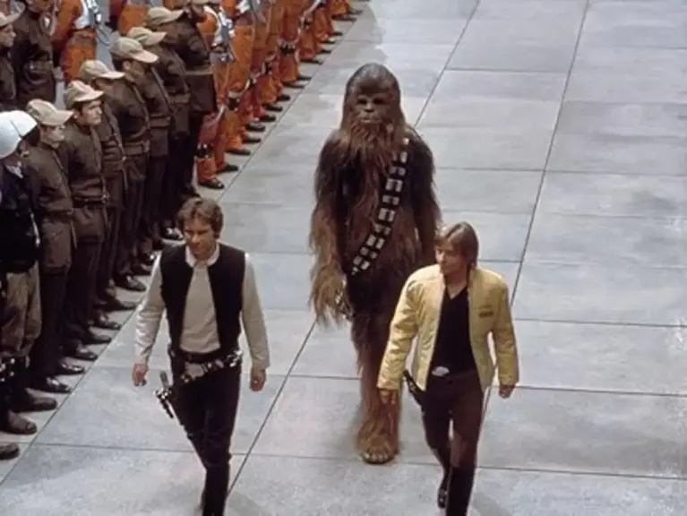 Image of Luke, Han, and Chewy during the award ceremony in "Star Wars: A New Hope"