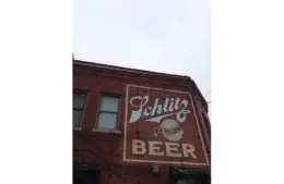 Old Schlitz Beer advertisement on a red brick building in Milwaukee Wisconsin