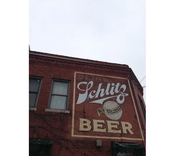 Old Schlitz Beer advertisement on a red brick building in Milwaukee Wisconsin