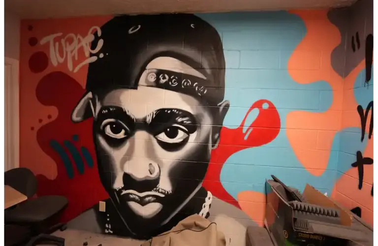 A mural of Tupac Shakur lines the wall in one of the VOICES rooms Wednesday, June 8, 2022, at VOICES in Indianapolis. The mural reflects a young black man whose message resonates with many of those at VOICES youth center. Blackfatherhoodonjuneteenth Mb 11