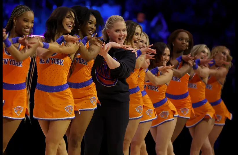 Feb 1, 2025; New York, New York, USA; American actress and comedian Amy Schumer dances with members of the Knicks city dancers as they perform during the second quarter between the New York Knicks and the Los Angeles Lakers at Madison Square Garden. 