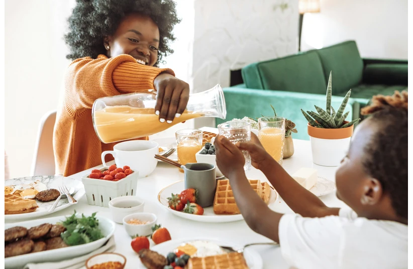 Two children preparing a relaxing brunch for Mom on Mother's Day