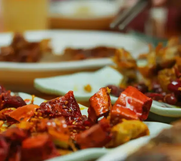 Vibrant and spicy Asian dishes featuring chili peppers, perfect for culinary enthusiasts embracing the spicy craze.