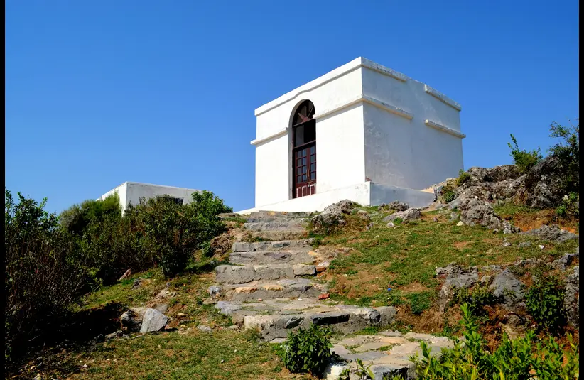 In this daily devotional, a white-washed tomb stands in the distance.