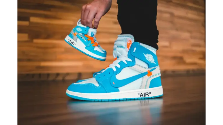 Bright blue sneakers with a smaller replica, showing trendy sneaker design indoors, highlighting modern style and strong jordan value for today’s collectors.