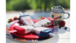 Ice cream treats with strawberries and blueberries pair beautifully with refreshing yogurt bites for a bright, fun dessert moment.