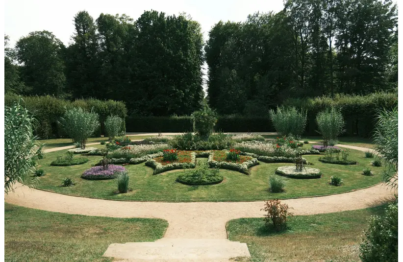 One of beautifully landscaped symmetrical natural gardens with lush greenery and colorful flowers