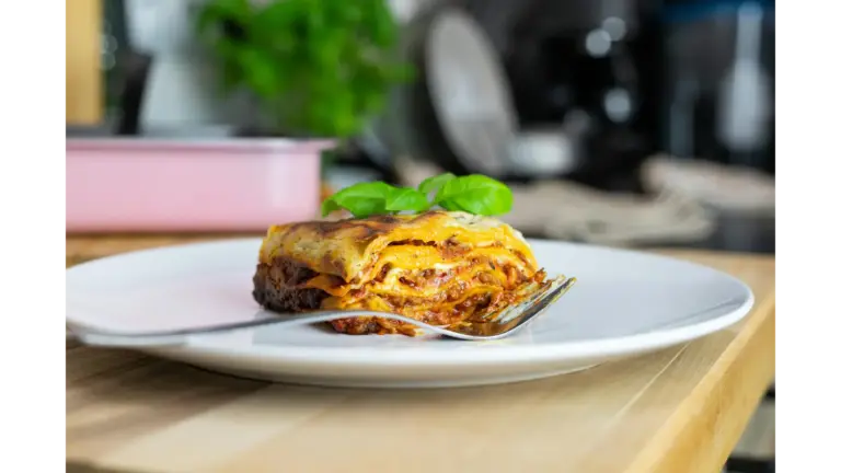Close-up of dumpling lasagna topped with basil, showcasing traditional Italian cuisine