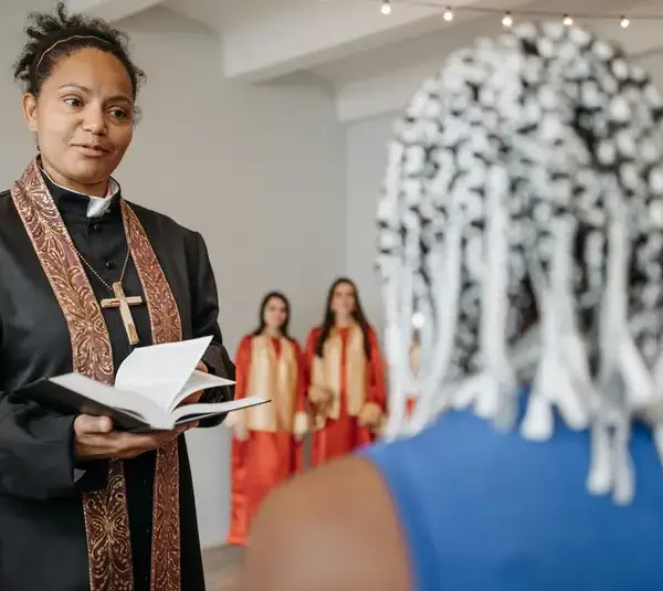 In daily devotional, a church leader speaks to a parishoner.