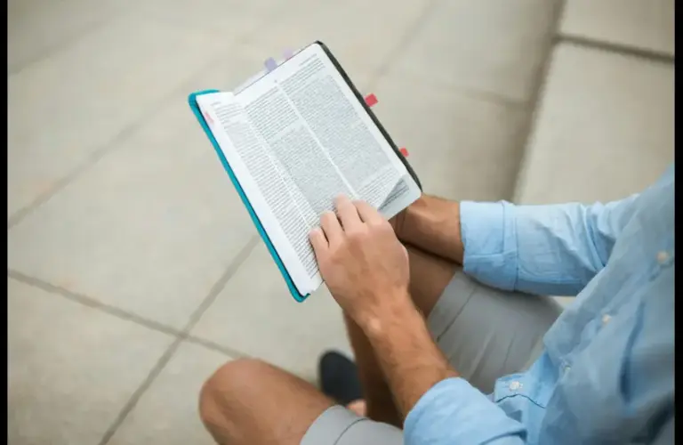 In the daily devotional, a man sits and reads the Bible.