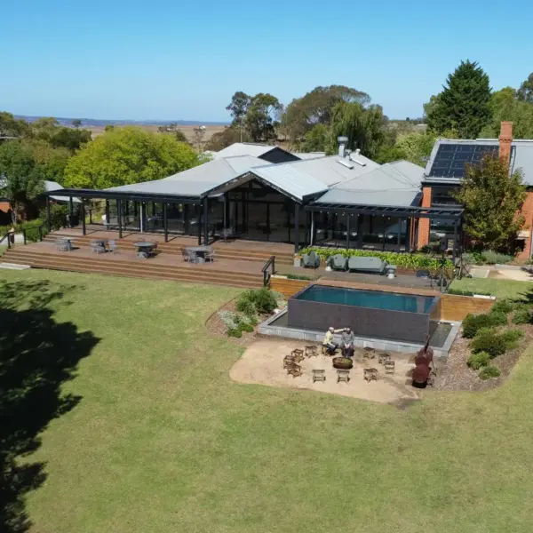 Aerial view of a homestead function with solar panels and garden in Lancefield, Victoria, Australia