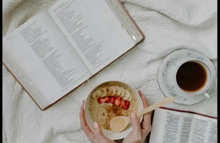 In daily devotional, someone has morning Bible study with coffee and cereal.