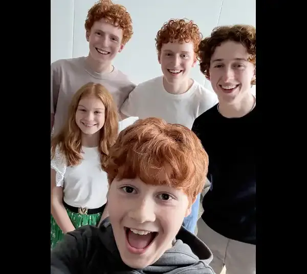 Tristan Harland, Gabriel Harland, Ruari Spooner, Gracie Cochrane, and Alastair Stout. Four stand in the background, and one is in the foreground, taking a selfie. Bright and cheerful for season one of Harry Potter.