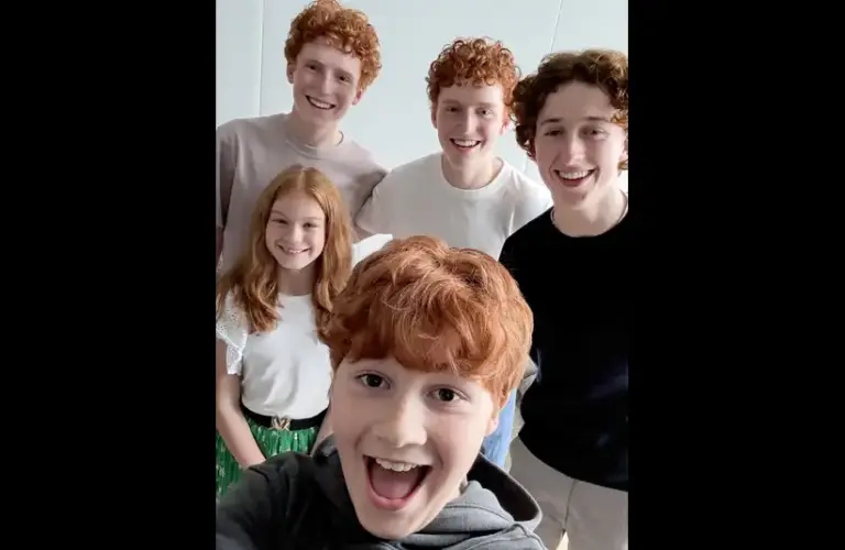 Tristan Harland, Gabriel Harland, Ruari Spooner, Gracie Cochrane, and Alastair Stout. Four stand in the background, and one is in the foreground, taking a selfie. Bright and cheerful for season one of Harry Potter.