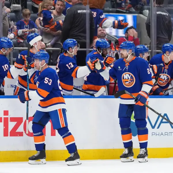 Apr 12, 2026; Elmont, New York, USA; New York Islanders center Casey Cizikas (53) and defenseman Scott Mayfield (24) celebrate a goal against the Montreal Canadiens in the third period at UBS Arena. Mandatory Credit: Alexander Wohl-Imagn Images