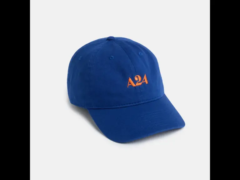 A blue hat with A24 on it in red ink.
