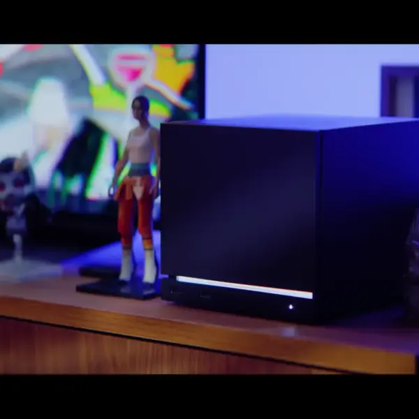 Valve's Steam Machine sitting on a desk.
