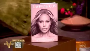 Laverne Cox's new book, Transcendent, on a brown table.