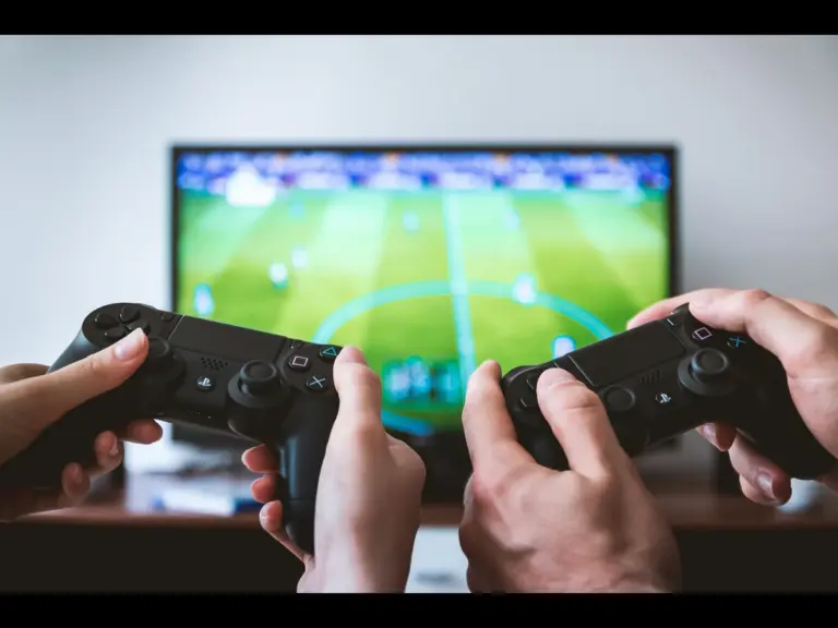 two people playing a football video game.