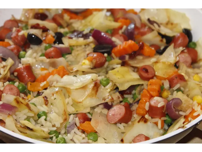 a dirty cabbage dish consisting of sausage and peppers with rice