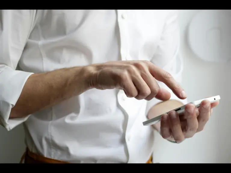 A person dialing a call on a smart phone