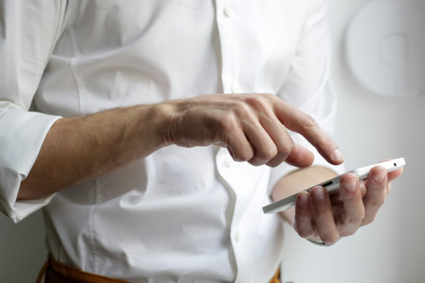 A person dialing a call on a smart phone