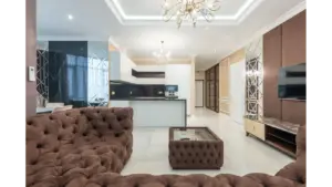 Cloud sofas bring instant cozy energy to a stylish modern living room, featuring plush furniture and elegant lighting