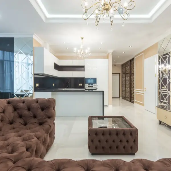 Cloud sofas bring instant cozy energy to a stylish modern living room, featuring plush furniture and elegant lighting