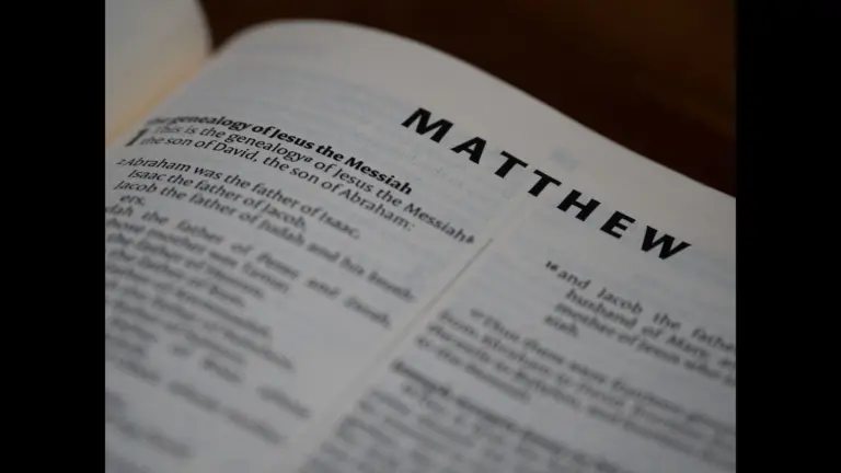 In dailyl devotional, a Bible is open to Matthew.