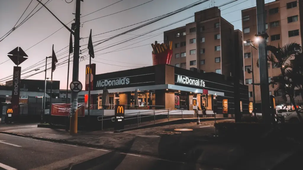 Fast food energy hits instantly in a twilight view of a McDonald's restaurant in an urban area, highlighting evening city life.