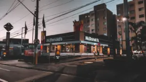 Fast food energy hits instantly in a twilight view of a McDonald's restaurant in an urban area, highlighting evening city life.
