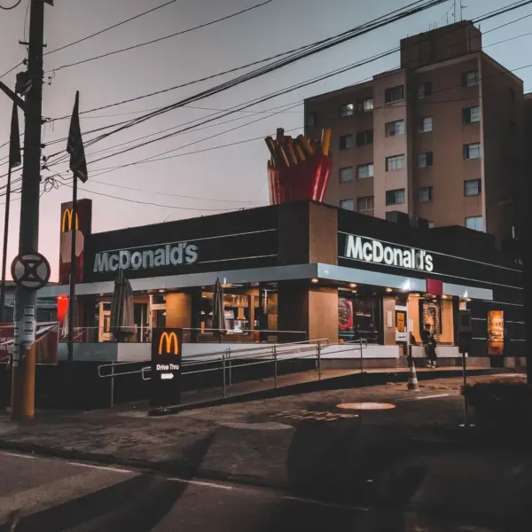 Fast food energy hits instantly in a twilight view of a McDonald's restaurant in an urban area, highlighting evening city life.