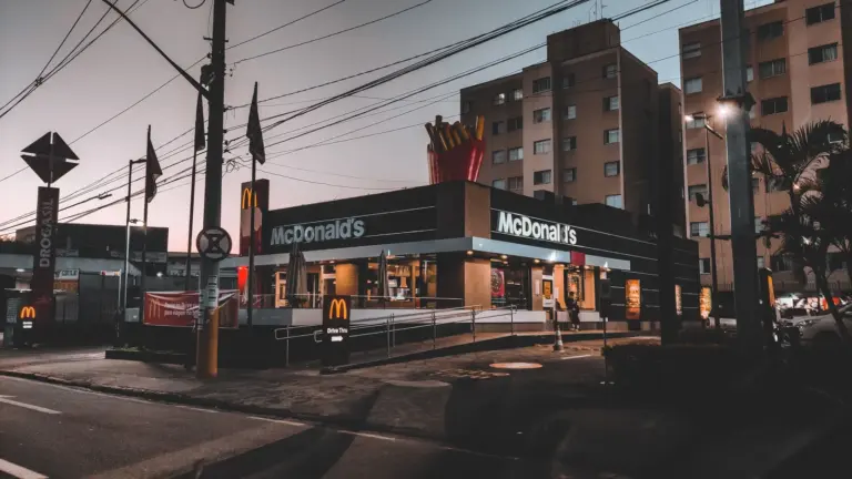 Fast food energy hits instantly in a twilight view of a McDonald's restaurant in an urban area, highlighting evening city life.
