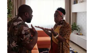 Arguing dreams come to life as a couple argues passionately in their living room, expressing raw emotions through intense gestures and heated energy.
