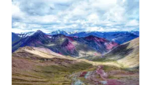 Stunning view of Rainbow Mountain in the Andes, showcasing vibrant colors and sweeping landscapes shaped by the kind of unusual nature that doesn’t even look real.